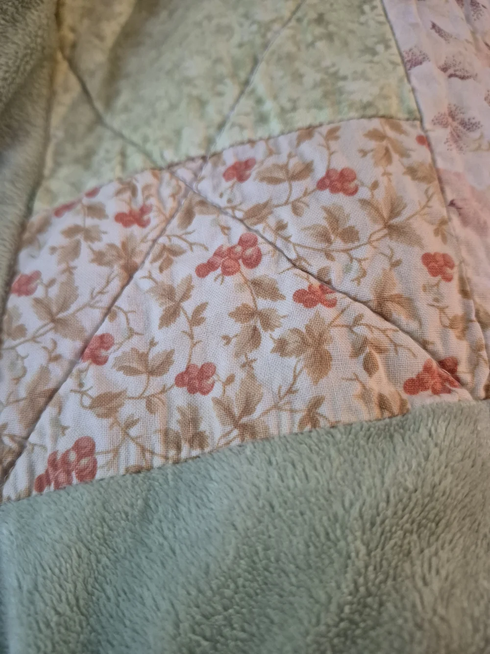 Patchwork Quilt in Purple, Green, and Cream - Cozy Floral Block Design